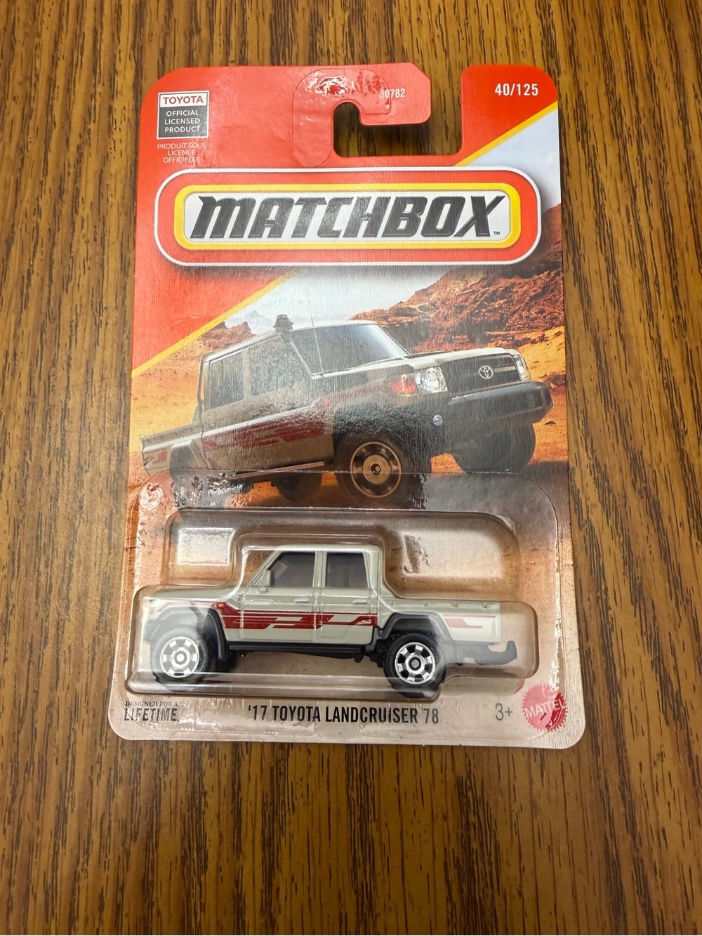 Matchbox White Toyota Land Cruiser 78 Pickup with Red Stripe Decals